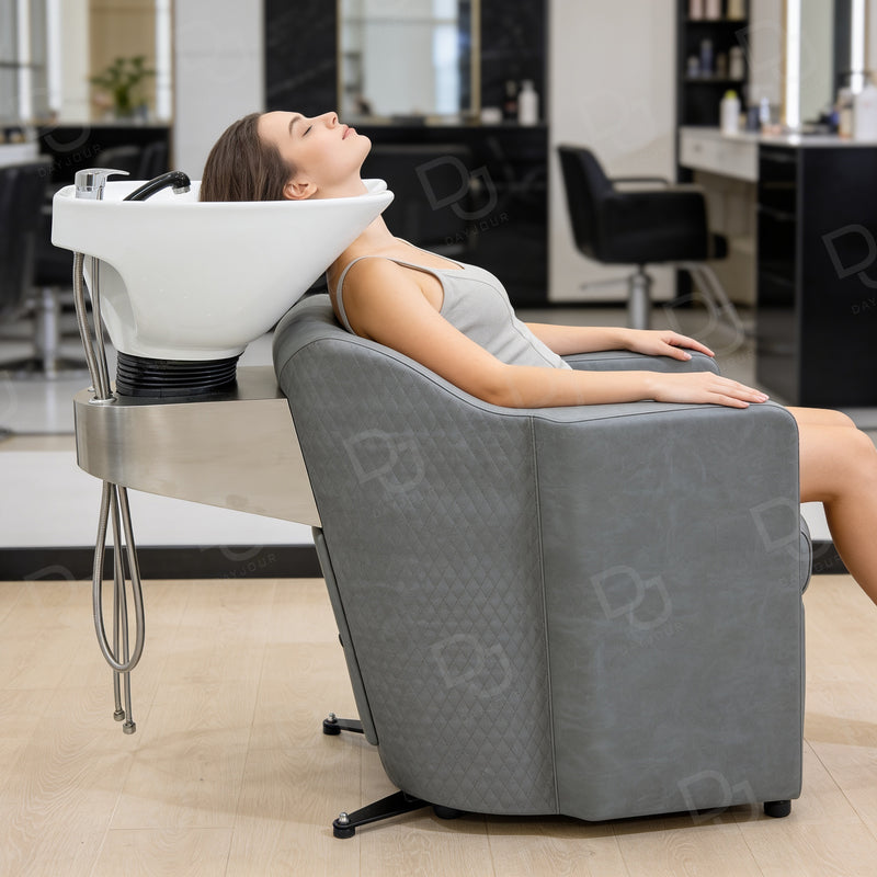 Professional grey salon hair washing chair with integrated white ceramic shampoo basin