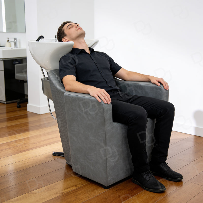 Professional grey salon hair washing chair with integrated white ceramic shampoo basin