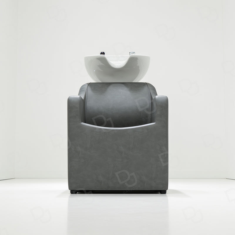Professional grey salon hair washing chair with integrated white ceramic shampoo basin