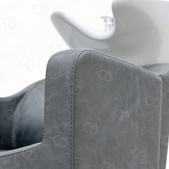 Professional grey salon hair washing chair with integrated white ceramic shampoo basin