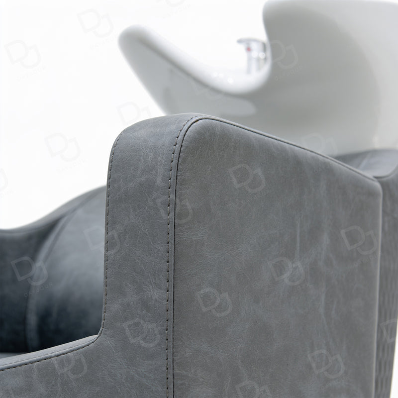 Professional grey salon hair washing chair with integrated white ceramic shampoo basin