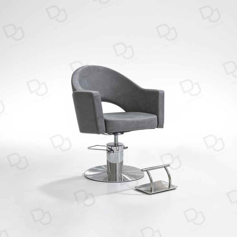 grey ladies styling chair with curved padded backrest, hydraulic chrome base and salon footrest