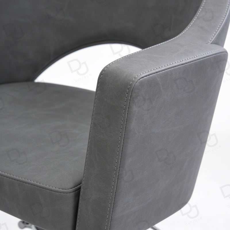 grey ladies styling chair with curved padded backrest, hydraulic chrome base and salon footrest
