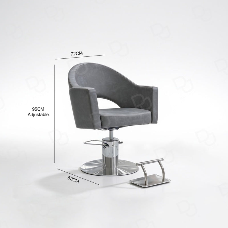 grey ladies styling chair with curved padded backrest, hydraulic chrome base and salon footrest